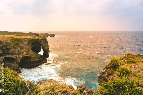 View of Cave Manzamo with lighting sunset in Okinawa, Japan. This is one of famous place in Okinawa.  photo