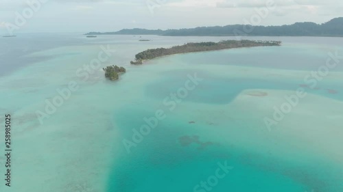 Aerial: flying over coral reef tropical caribbean sea turquoise blue water. Indonesia Sumatra Banyak islands. Top travel destination, best diving snorkeling. Native cinelike D-log color profile photo