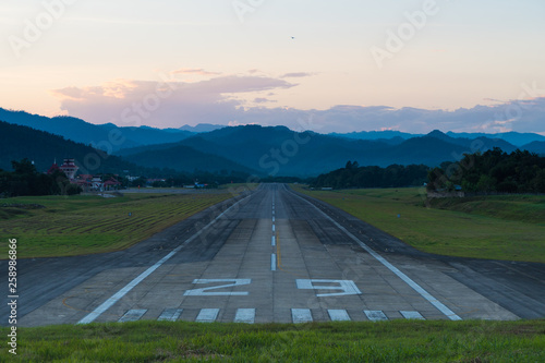 Airport runway sunset. photo