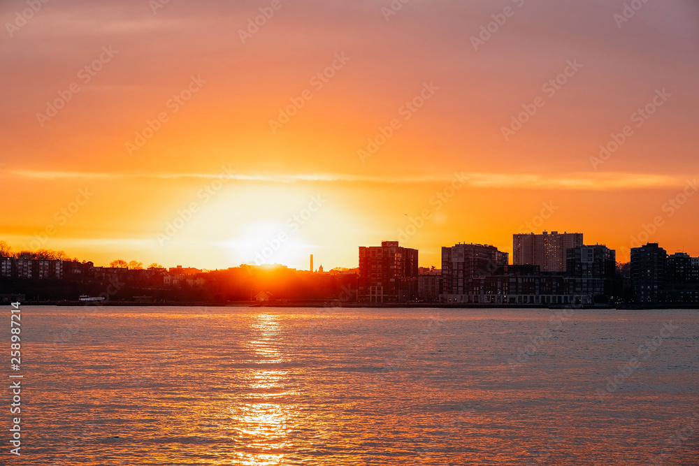 Sunset view of Jersey skyline from Pier 64 in Chelsea New York City