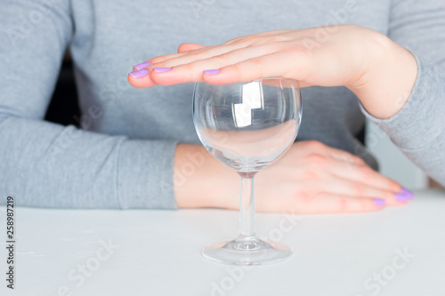 Photos young woman and empty glass - refusal of alcohol