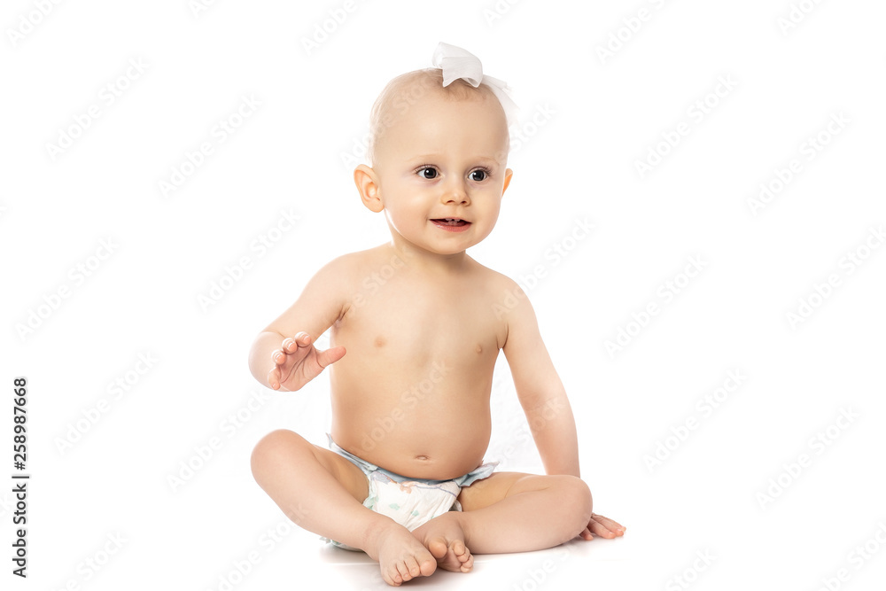smiling funny baby getting a diaper change. with wipe isolated on a white background. concept cleaning wipe, pure, clean smiling funny baby getting a diaper change. with wipe isolated on a white background. concept cleaning wipe, pure, clean
