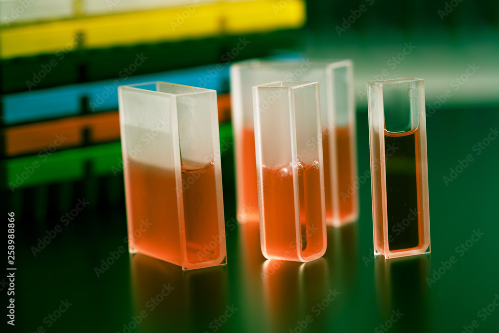 Quartz cuvette with the sample liquid for measurement Stock Photo