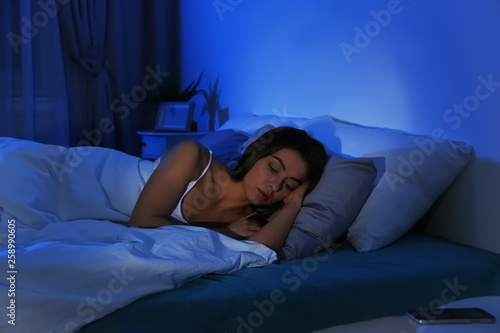 Young woman suffering from insomnia at home. Bedtime