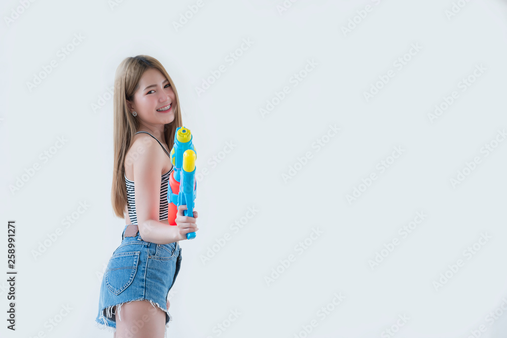 Asian sexy woman with gun water in hand on white background,Festival songkran day at thailand,The best of festival of thai,Land of smile Asian sexy woman with gun water in hand on white background,Festival songkran day at thailand,The best of festival of thai,Land of smile