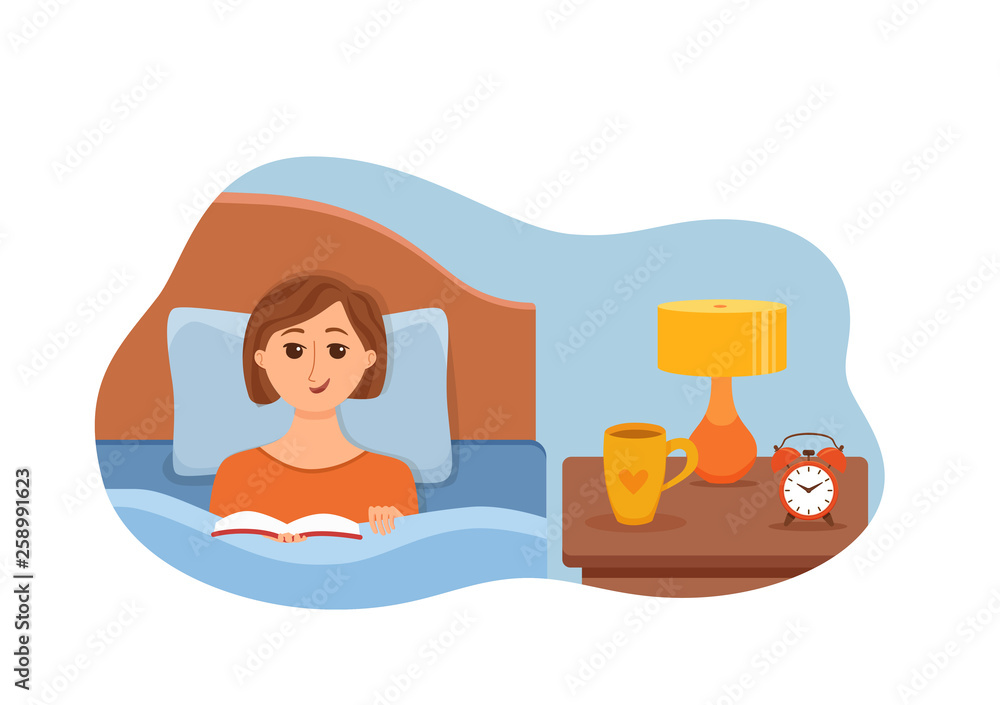 Girl lying on bed in home bedroom and reading a book