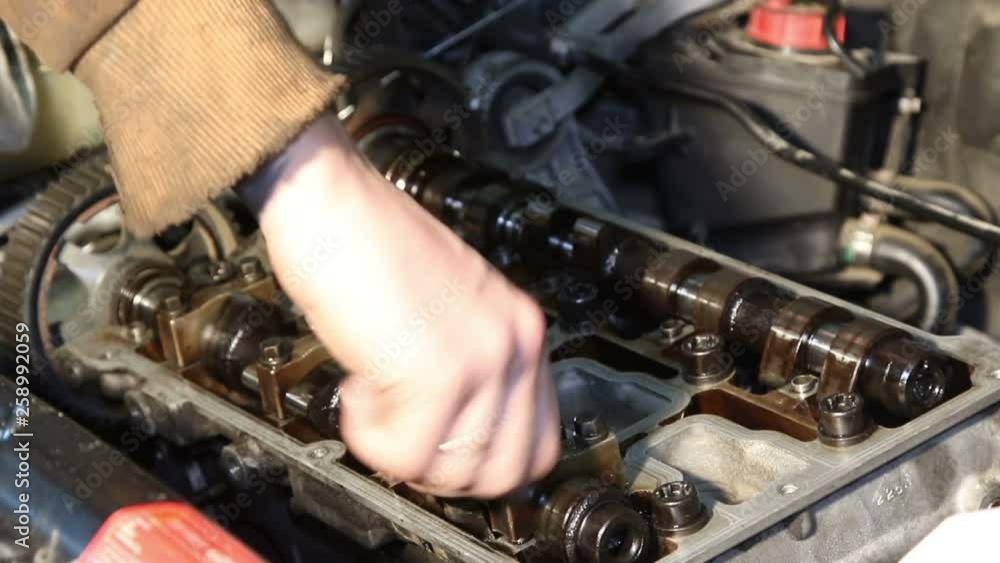 Mechanic repairs the car engine Mechanic repairs the car engine