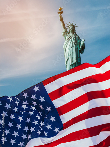 Double exposure with the American flag and the Statue of liberty. Background for independence day - 4th of July.