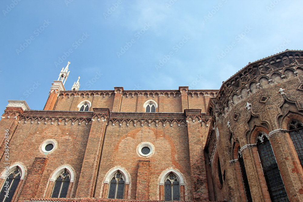 old ancient medieval gothic venetian catholic cathedral Santi Giovanni e Paolo with red brick walls in Venice, Italy
