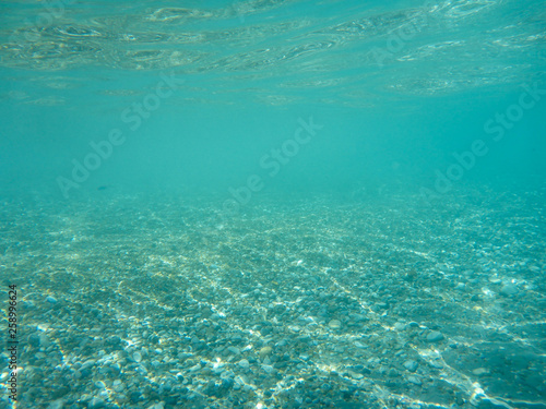 Underwater view of the beautiful Skala beach of Kefalonia island, Ionian sea, Greece.