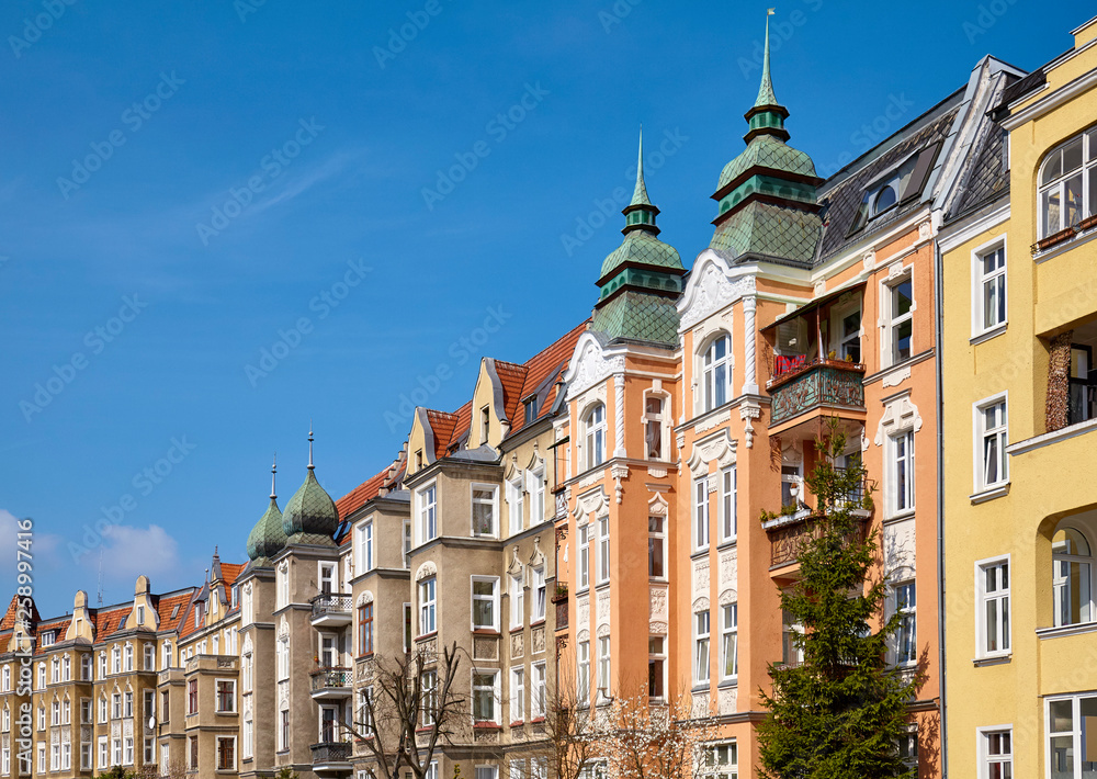 Partly renovated tenements at Slowackiego Street in Szczecin (Stettin) city on a beautiful spring day,  Poland.