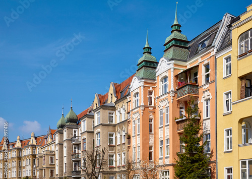Partly renovated tenements at Slowackiego Street in Szczecin (Stettin) city on a beautiful spring day, Poland.