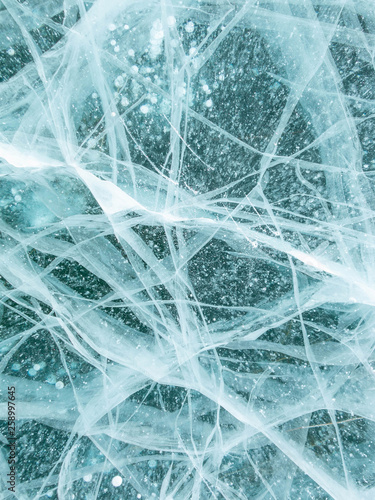 Background and texture of frozen surface of Lake Baikal in winter.