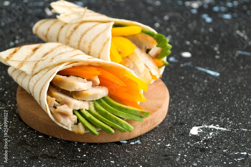 Burrito with grilled chicken and vegetables (fajitas, pita bread, Shawarma)