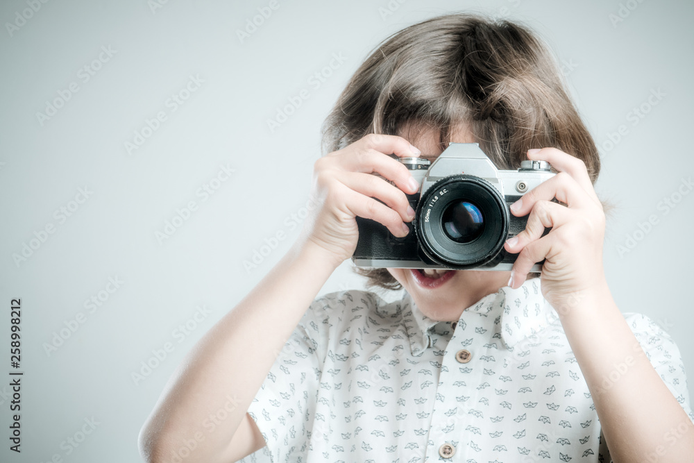 Kid with old photo camera Kid with old photo camera