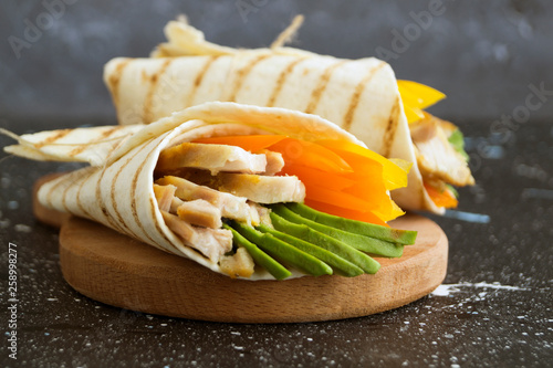 Burrito with grilled chicken and vegetables (fajitas, pita bread, Shawarma)