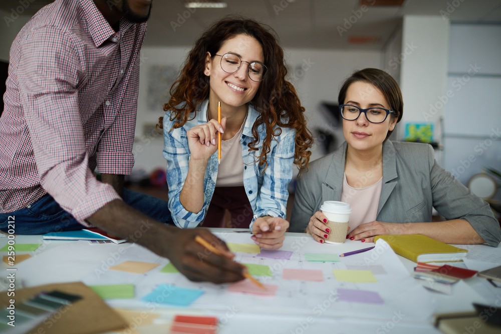 Fototapeta premium Portrait of contemporary business team planning project drawing roadmap in office, copy space