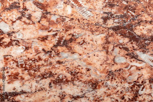 close up of a polished red marbled granite texture
