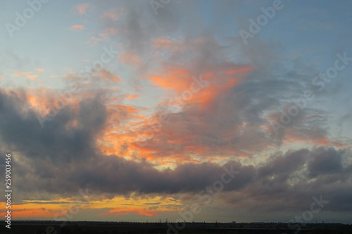 Beautiful orange sunset background over the fiel