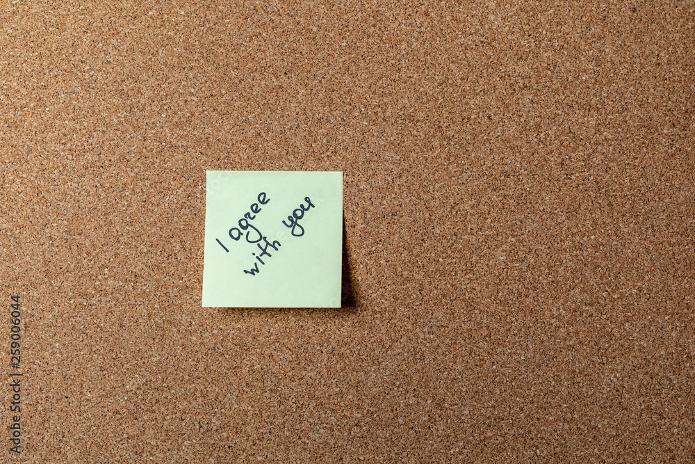 green sticker on brown table. color sticker, motivational, quote and words, note, message green sticker on brown table. color sticker, motivational, quote and words, note, message