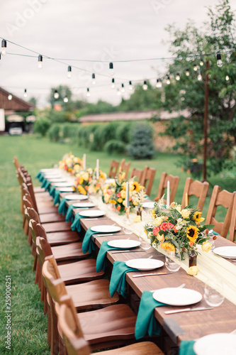 Table settings for a luxury wedding reception. Outdoor wedding © smishura