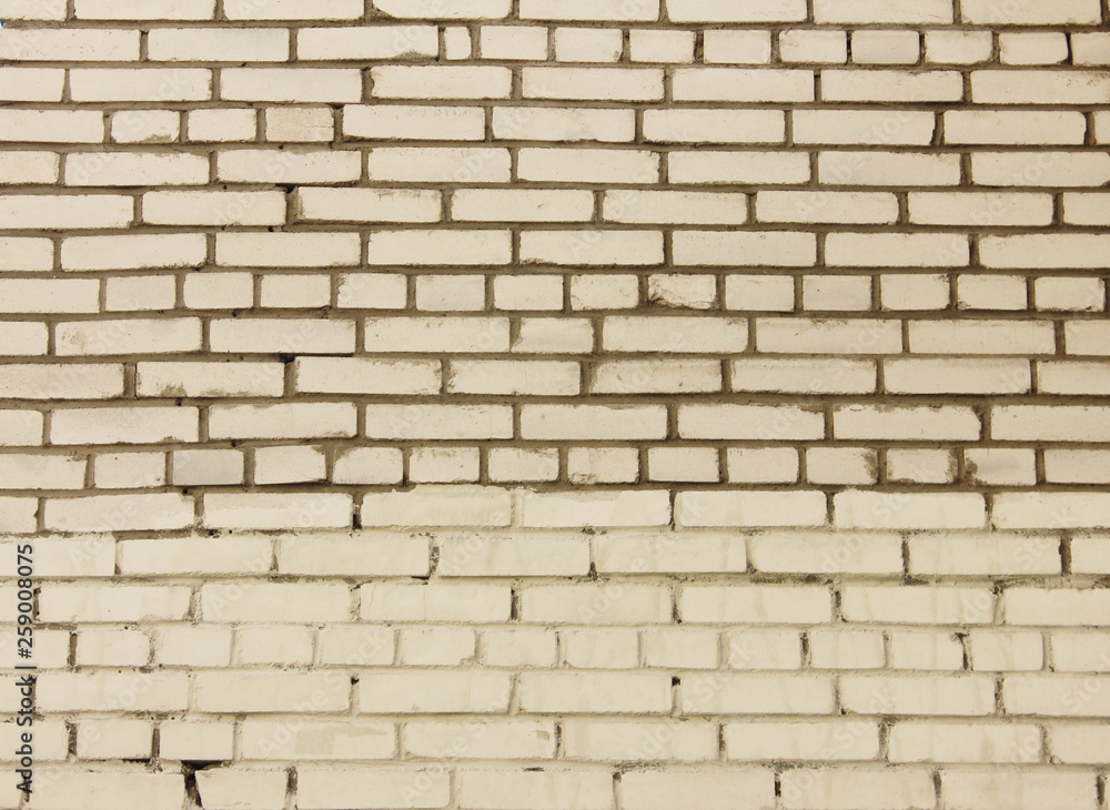 White brickwork background. Empty masonry produced by a bricklayer with bricks and mortar in brick wall structure. Brick courses of different size blank rough texture White brickwork background. Empty masonry produced by a bricklayer with bricks and mortar in brick wall structure. Brick courses of different size blank rough texture