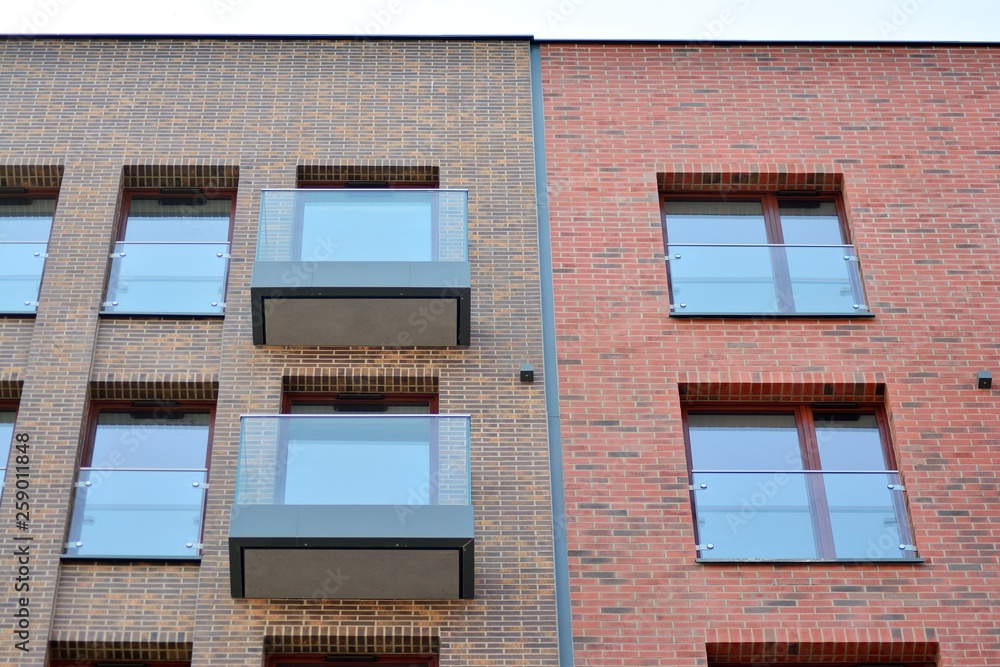 Obraz premium Fragment of a modern apartment building in front. Very modern apartment house.