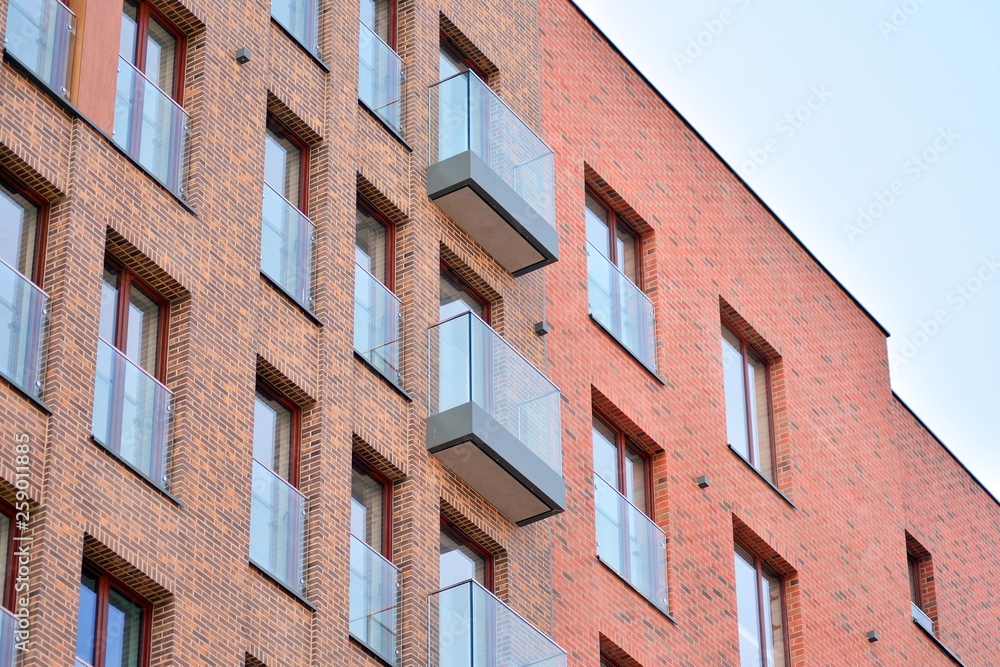 Fototapeta premium Fragment of a modern apartment building in front. Very modern apartment house.