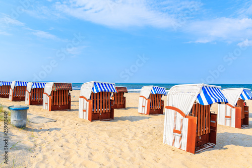 Wicker chairs on sandy beach in Baabe summer resort, Ruegen island, Baltic Sea, Germany