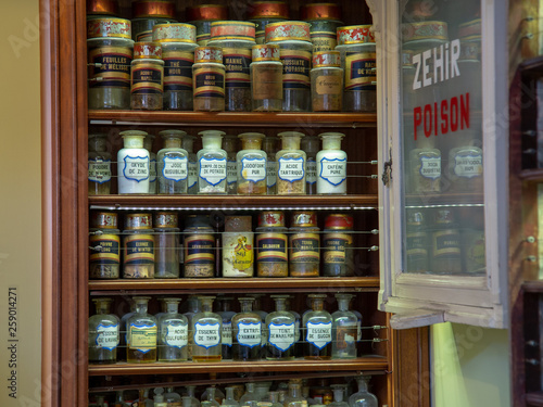 Glass bottles on shelf Vintage style Pharmacy medical container © Ruslan Gilmanshin