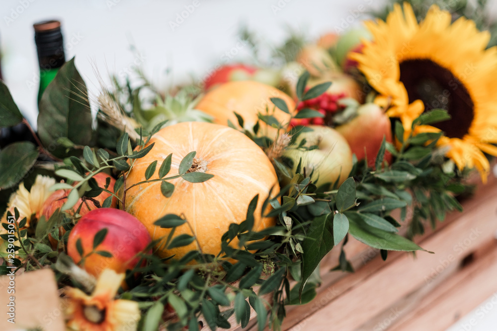 The decor of the table served in yellow. Sunflowers, grapefruits and wooden cutting boards for text.