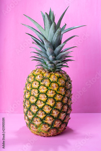 Raw pineapple on colorful background
