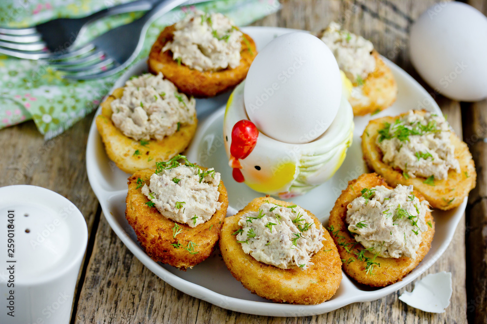 Traditional Easter snack stuffed eggs deep fried and filled with tuna, yolk, dill and mayonnaise