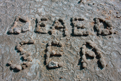 Words DEAD SEA makes from stones on the beach of real Dead sea in Israel