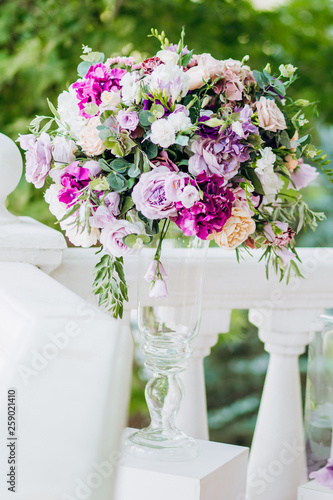 Wedding bouquet on the background of the bride and groom