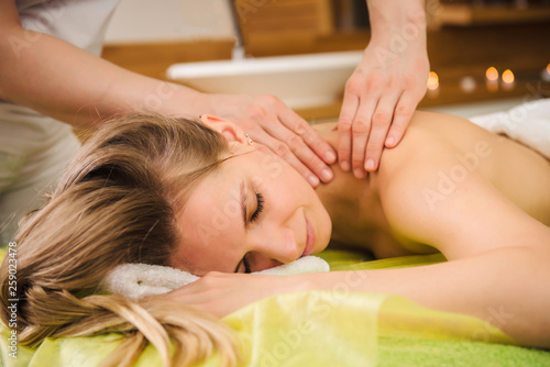 Woman enjoying classical neck and shoulder massage