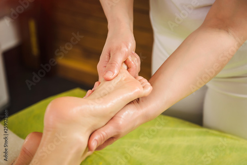 Woman having traditional foot massage