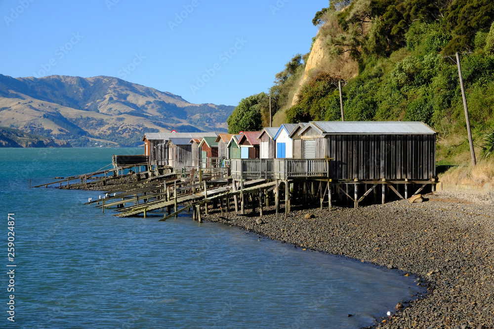 Boat sheds in Robinson Bay, Banks Peninsula near Akaroa, New Zealand