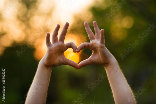 Heart shape hand of kid's body language for children's love, kindness, love concept. photo