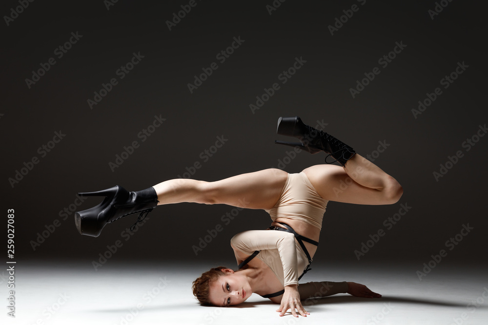 Fotografie Elegant female dancing striptease dance