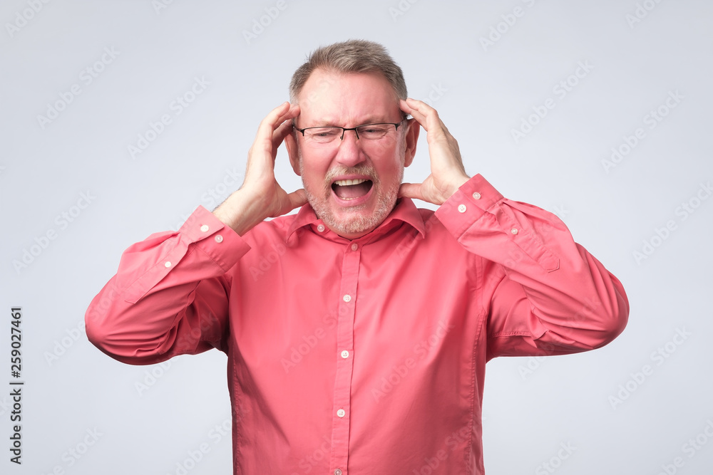 man having painful look. Terrible headache concept man having painful look. Terrible headache concept