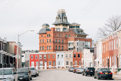 Row houses and the American Brewery Building, in Baltimore, Maryland