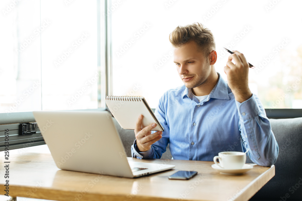 Stylish young man calling by the phone to solve business problems. Online consultation by phone. Freelancer discussing the development and planning of his online project. Outsourcing. Mobile services. Stylish young man calling by the phone to solve business problems. Online consultation by phone. Freelancer discussing the development and planning of his online project. Outsourcing. Mobile services.
