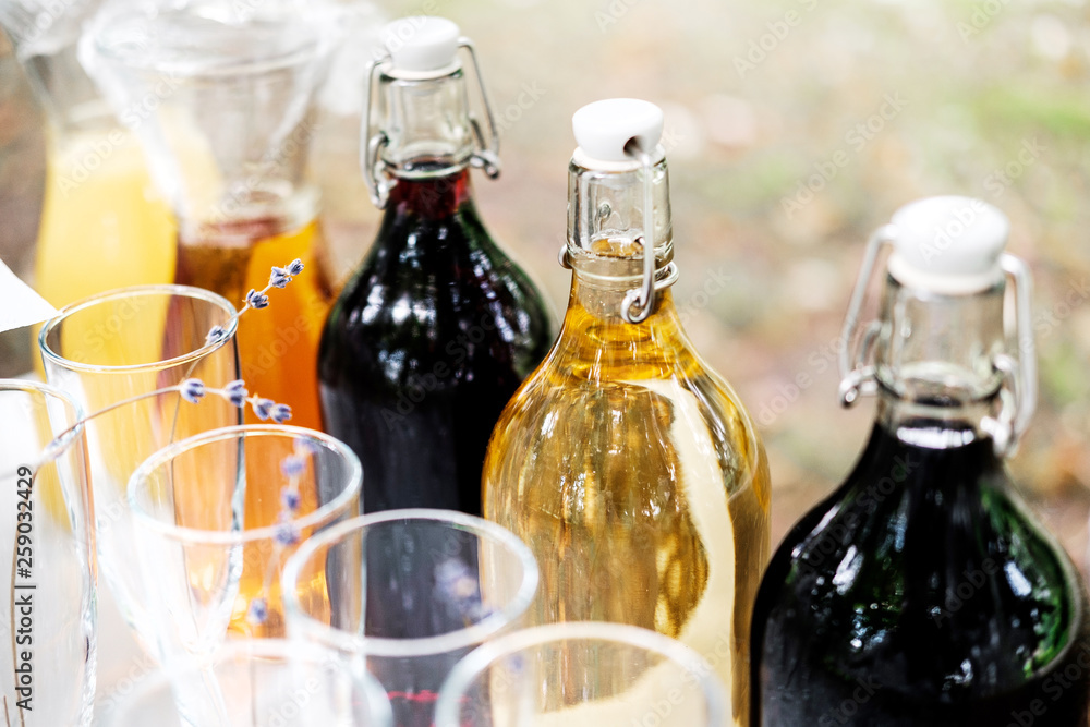 Bottles with different drinks in outdoor buffet. Bottles with different drinks in outdoor buffet.