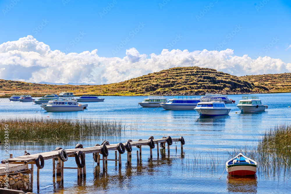 Motor boats anchored at the coast of Titicaca lake, Bolivia