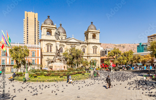 Plaza Murillo, La Paz central square full of pigeons with cathedral in the background, Bolivia photo