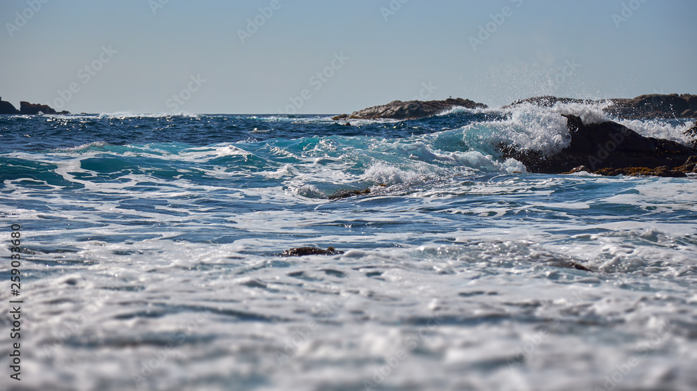 Bottom view of sea waves in Costa Brava of Spain with rock Bottom view of sea waves in Costa Brava of Spain with rock
