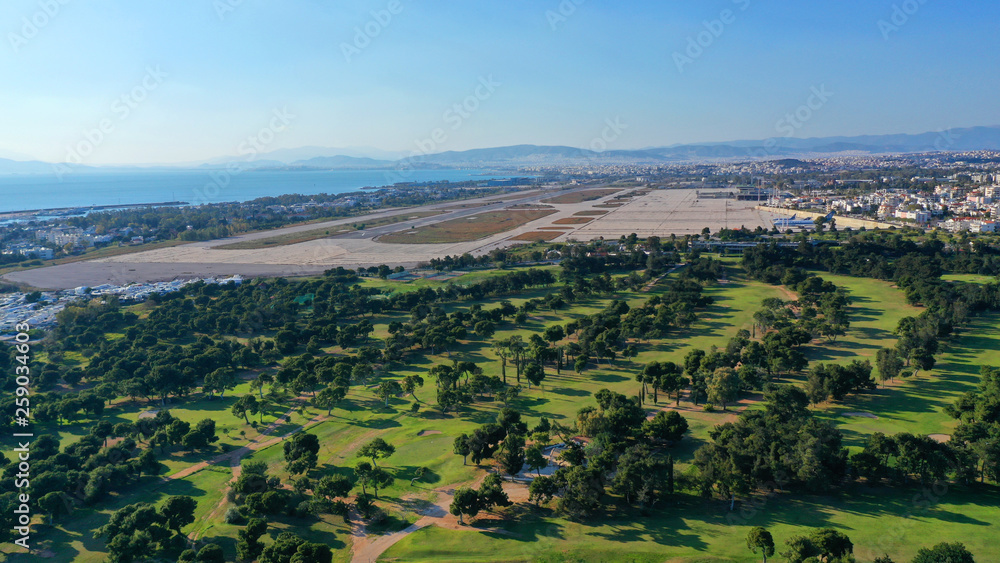 Obraz premium Aerial drone photo of famous Golf course in Glyfada area next to abandoned Elliniko airport, South Athens riviera, Attica, Greece