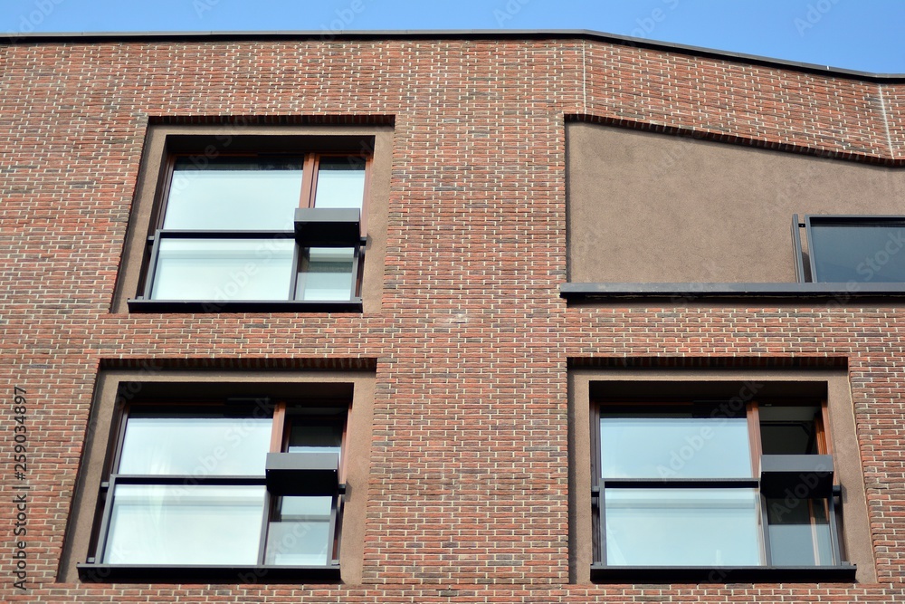 Fototapeta premium Fragment of a modern apartment building in front. Very modern apartment house.