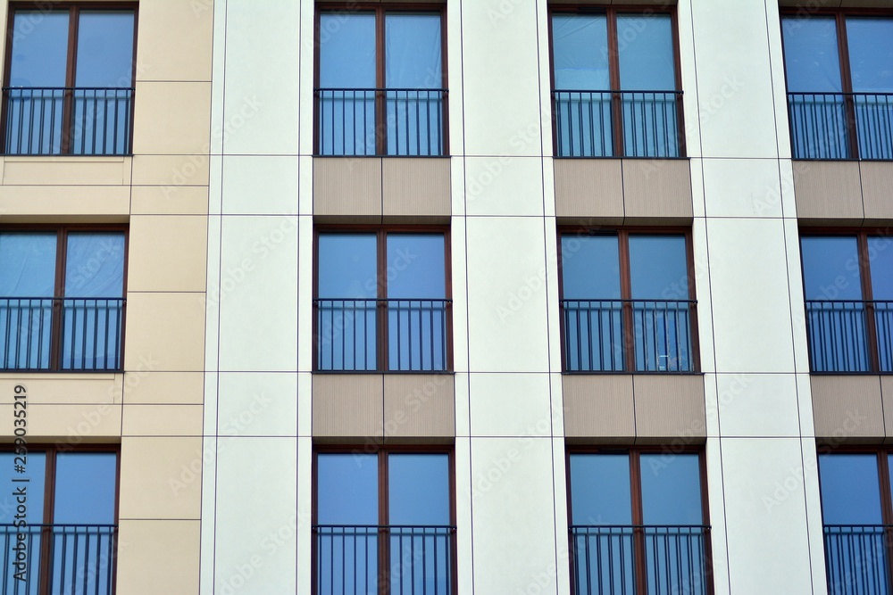 Fragment of a modern apartment building in front. Very modern apartment house. Fragment of a modern apartment building in front. Very modern apartment house.